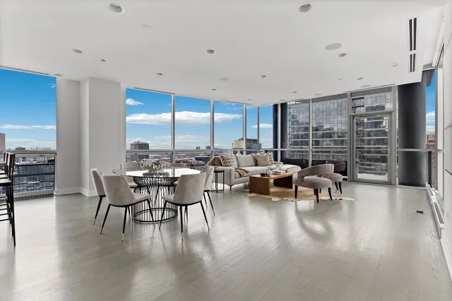 a view of a patio with table and chairs