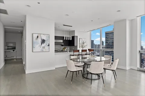 a dining room with furniture and window