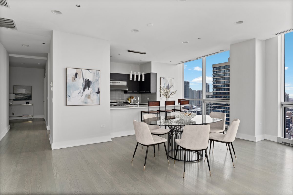 110 West Superior Street, Unit 2503 Chicago, IL 60654 - Photo 6 of 34 a dining room with furniture and window
