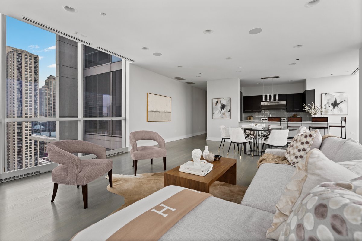 110 West Superior Street, Unit 2503 Chicago, IL 60654 - Photo 7 of 34 a living room with furniture and a large window