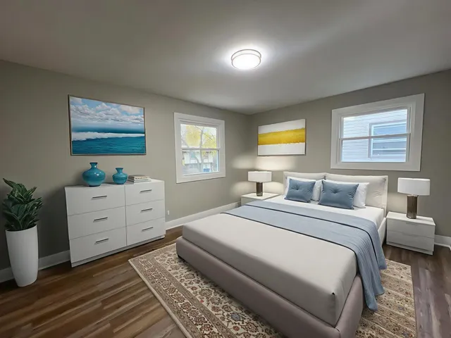 a bedroom with a bed and a dresser