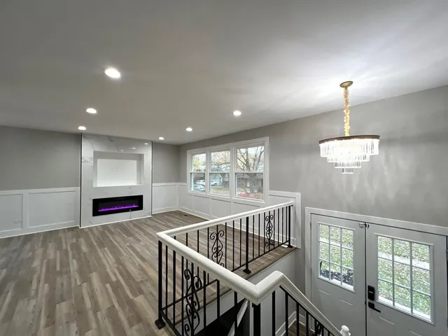 a kitchen with stainless steel appliances granite countertop a stove and a sink
