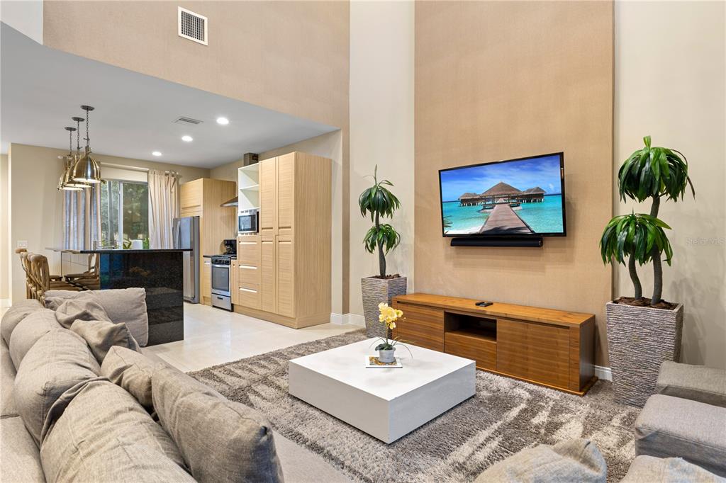 7657 Amazonas Street Kissimmee, FL 34747 - Photo 20 of 53 a living room with furniture and a flat screen tv