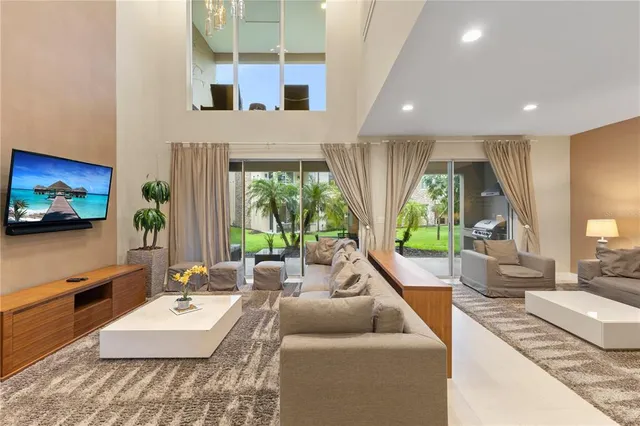 a view of a living room and kitchen