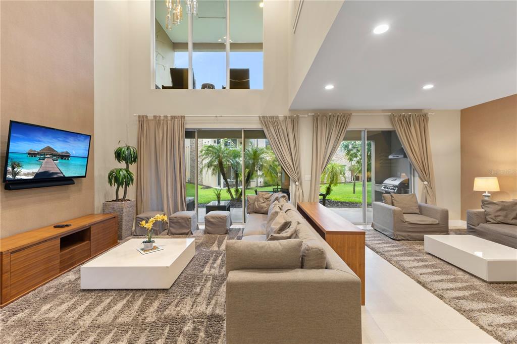 7657 Amazonas Street Kissimmee, FL 34747 - Photo 22 of 53 a living room with furniture and a flat screen tv