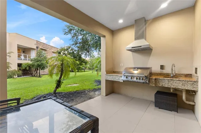 a swimming pool with outdoor seating and yard