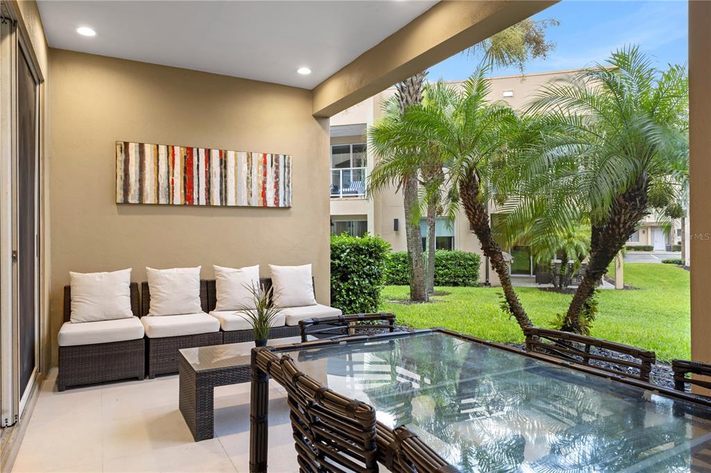 7657 Amazonas Street Kissimmee, FL 34747 - Photo 24 of 53 a swimming pool with outdoor seating and yard