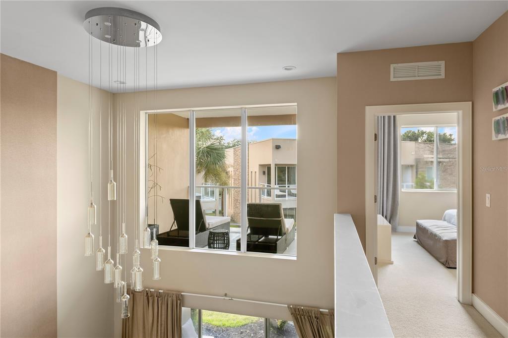 7657 Amazonas Street Kissimmee, FL 34747 - Photo 29 of 53 a living room with furniture and a large window