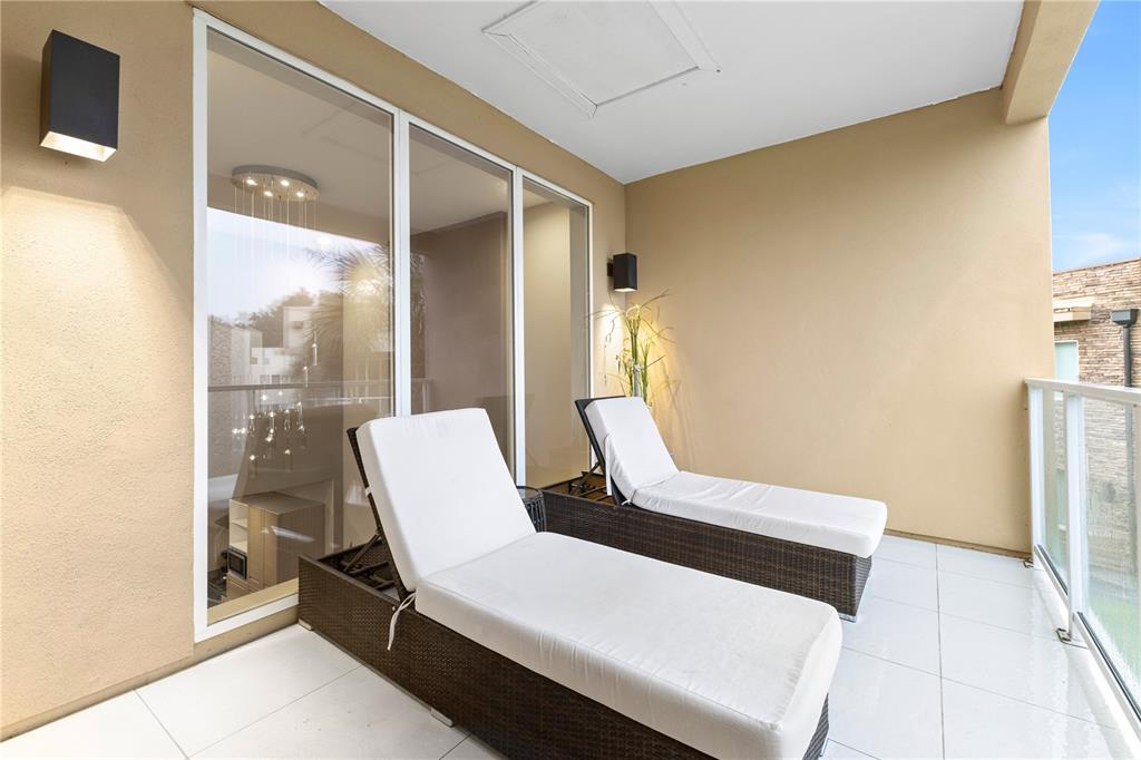 7657 Amazonas Street Kissimmee, FL 34747 - Photo 33 of 53 a living room with a bed furniture and a large window