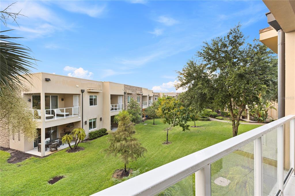 7657 Amazonas Street Kissimmee, FL 34747 - Photo 35 of 53 a view of a house with a yard from a balcony
