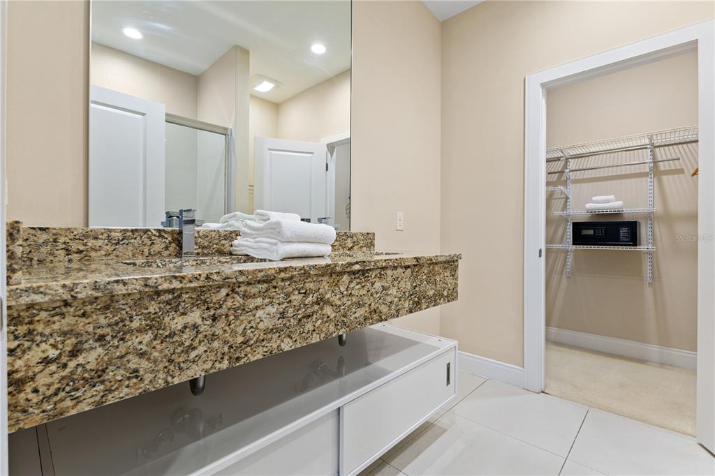 7657 Amazonas Street Kissimmee, FL 34747 - Photo 36 of 53 a bathroom with a granite countertop sink and a mirror