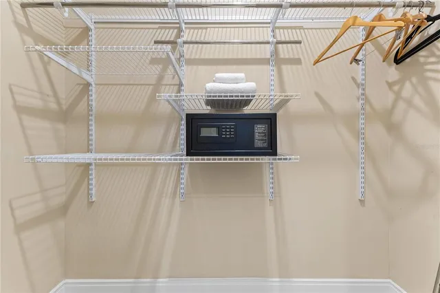 a bedroom with two beds and a painting on the wall