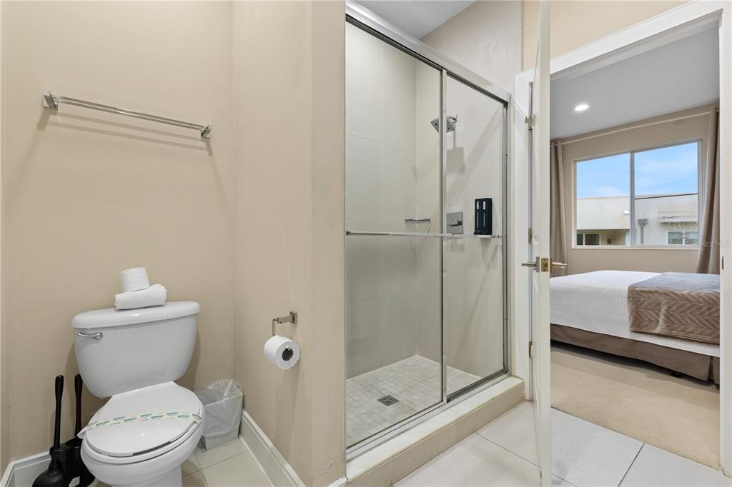 7657 Amazonas Street Kissimmee, FL 34747 - Photo 38 of 53 a bathroom with a shower a toilet and a shower