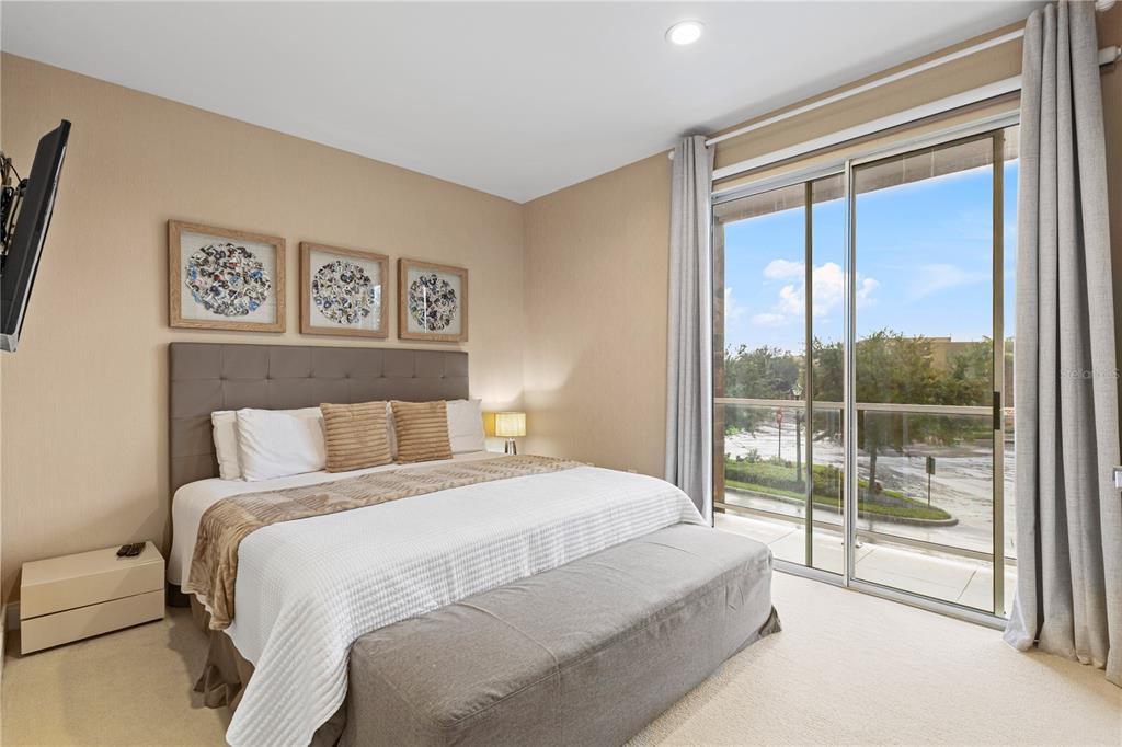 7657 Amazonas Street Kissimmee, FL 34747 - Photo 43 of 53 a bed sitting in a bedroom next to a window