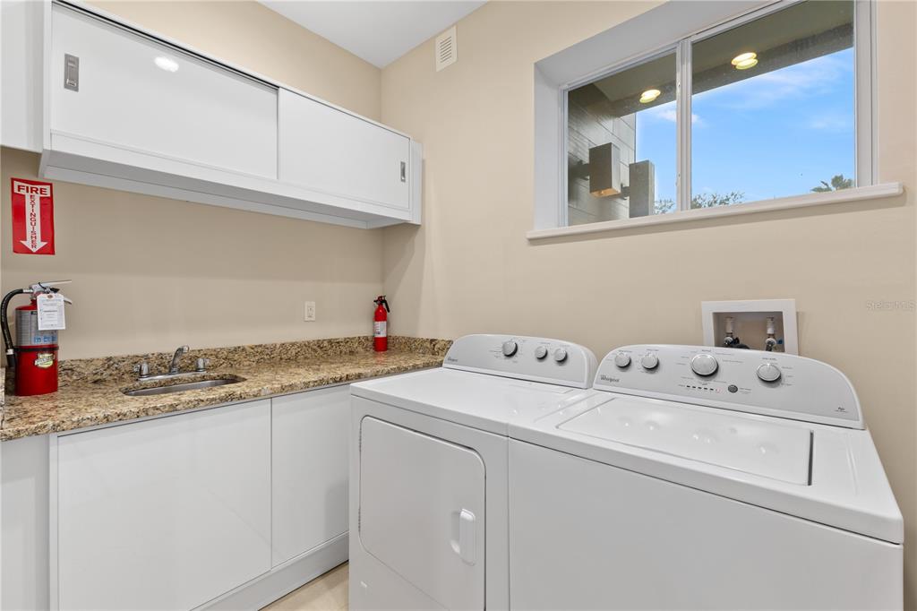 7657 Amazonas Street Kissimmee, FL 34747 - Photo 6 of 53 a utility room with dryer and washer