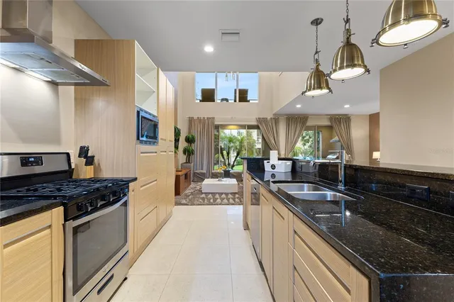 a view of living room with furniture and floor to ceiling window
