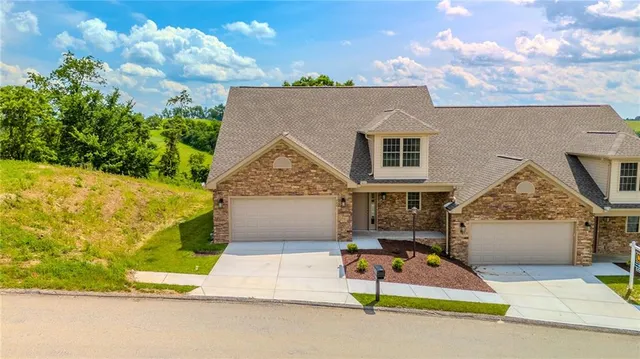 a house with tree in front of it