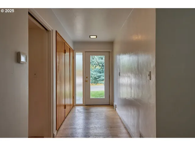 a view of entryway with wooden floor