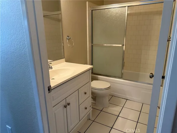 a view of a hallway with a door