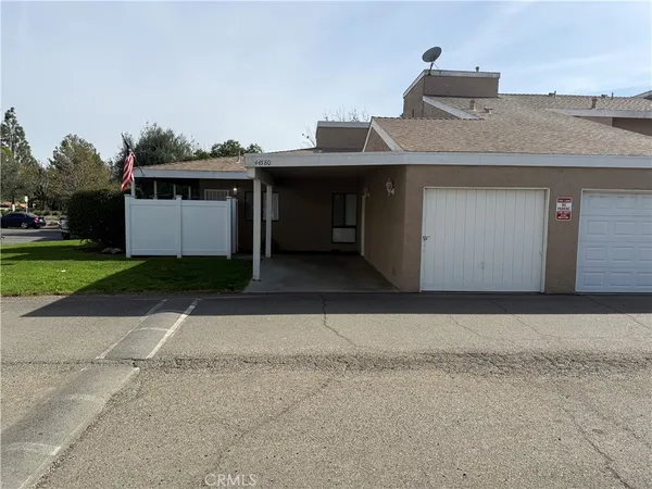a front view of a house with a garage