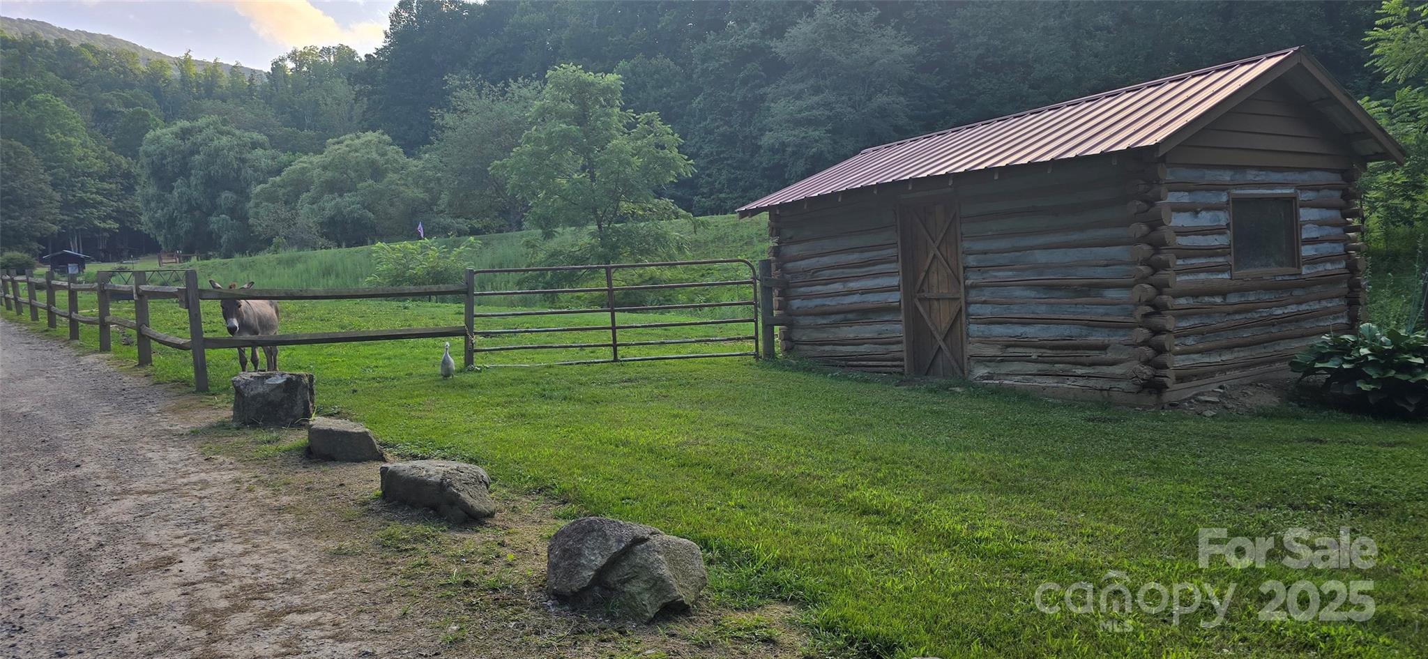 Lot 501 Spellbound Road Waynesville, NC 28785 - Photo 15 of 30 a view of a backyard with wooden fence