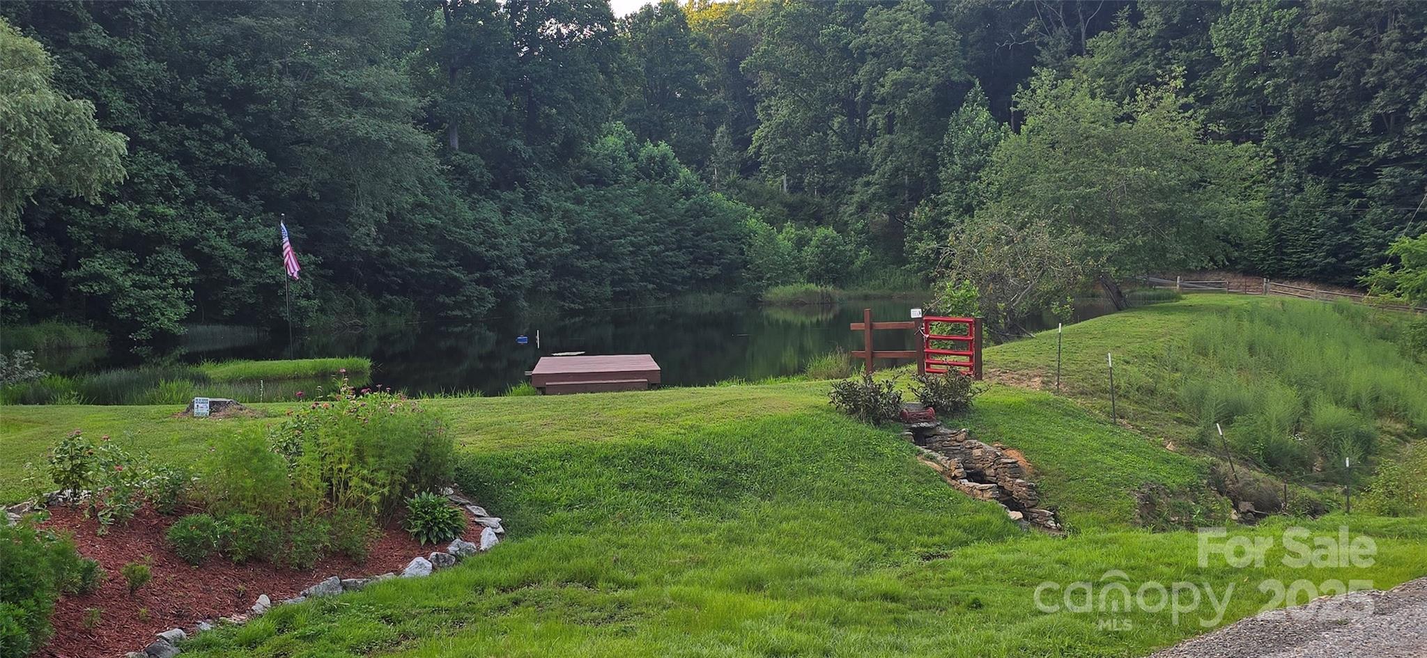 Lot 501 Spellbound Road Waynesville, NC 28785 - Photo 18 of 30 a backyard of a house with a yard and outdoor seating