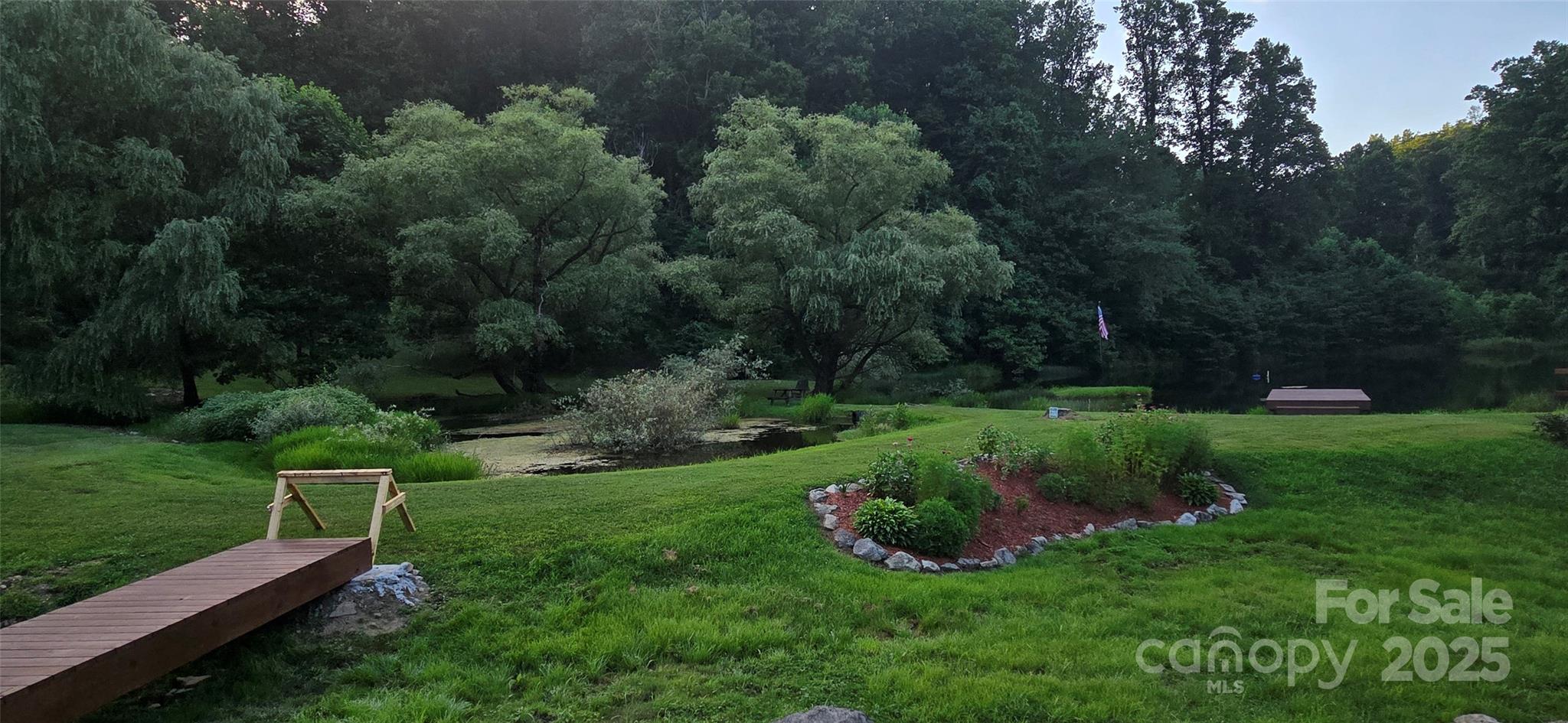 Lot 501 Spellbound Road Waynesville, NC 28785 - Photo 19 of 30 a view of a chair and table on the garden