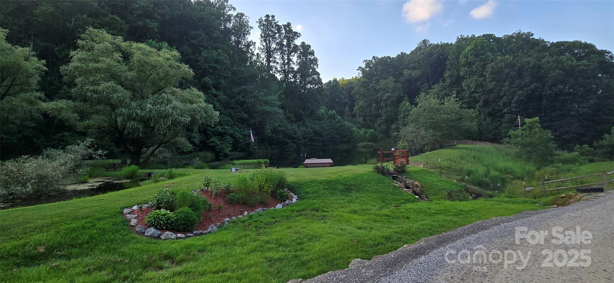 Lot 501 Spellbound Road Waynesville, NC 28785 - Photo 22 of 30 a view of a garden with large trees