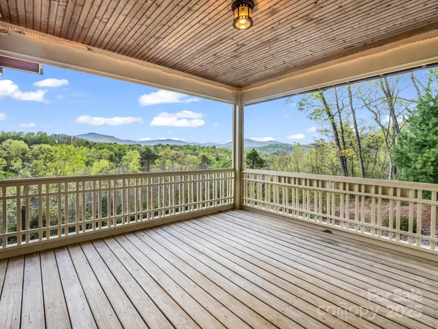 a view of balcony with wooden floor