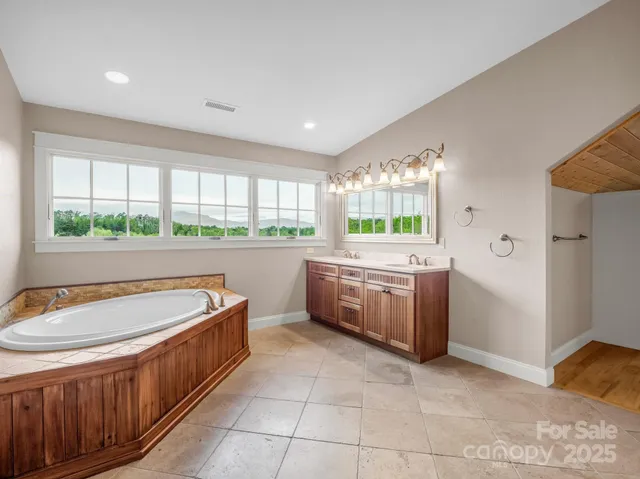 a kitchen with a stove sink and cabinets
