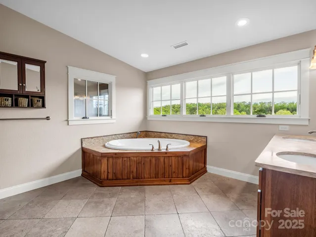 a living room with a large window and a table