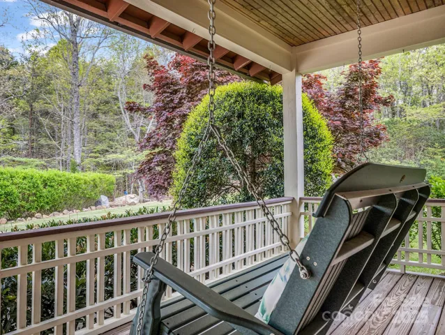 a view of a balcony with wooden floor
