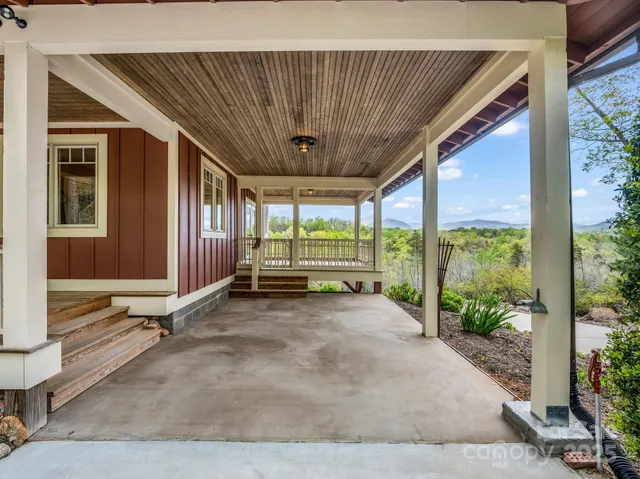 a view of a porch with wooden floor and stairs