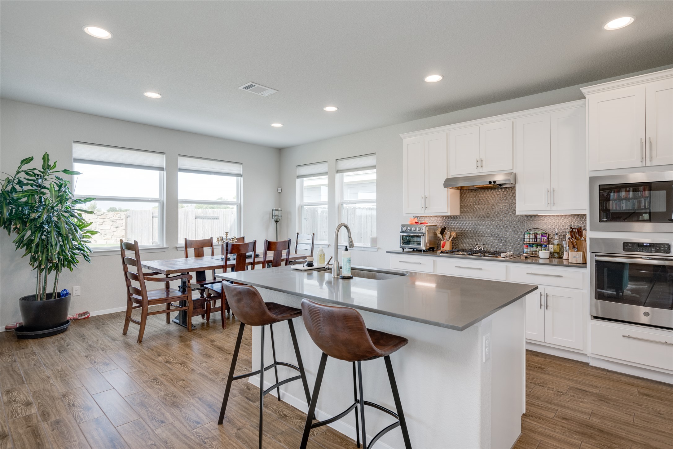 7948 Castelardo Place Round Rock, TX 78665 - Photo 3 of 32 a kitchen with sink and microwave