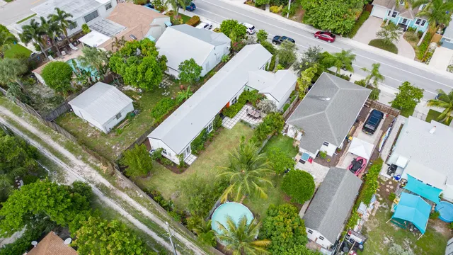 an aerial view of residential houses with city view
