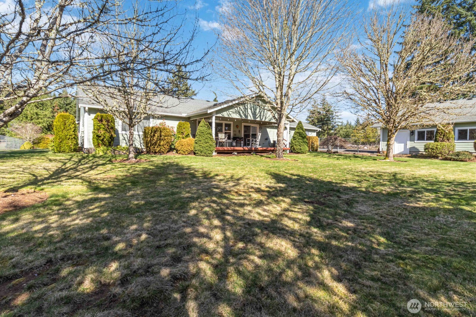 413 Haywire Road Winlock, WA 98596 - Photo 12 of 40 a big yard with large trees and a large tree