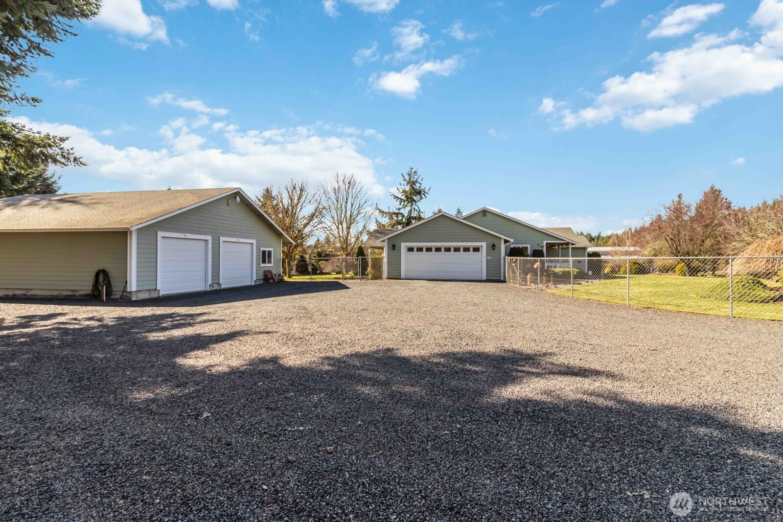 413 Haywire Road Winlock, WA 98596 - Photo 14 of 40 a front view of a house with a yard and garage