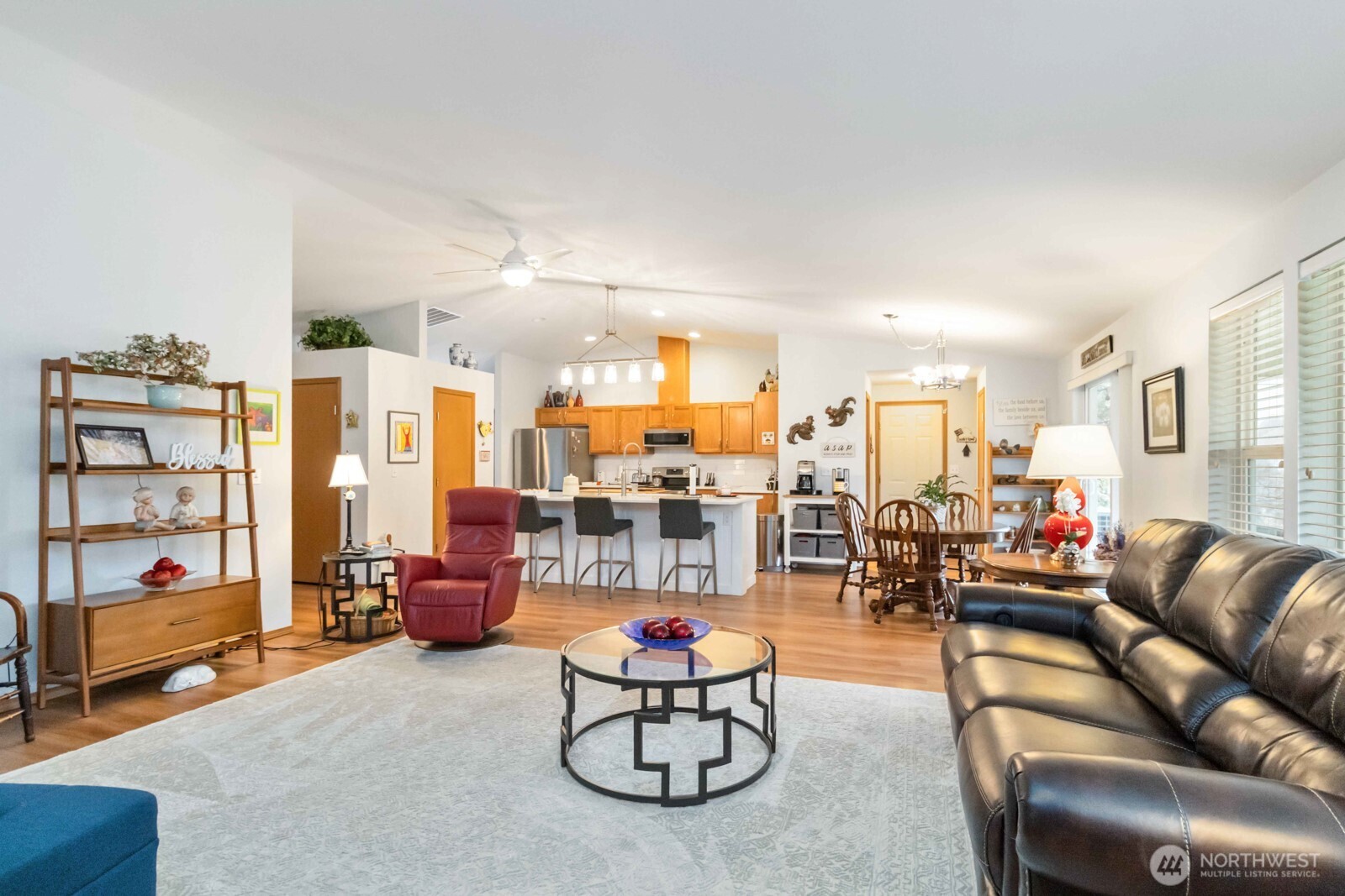 413 Haywire Road Winlock, WA 98596 - Photo 25 of 40 a living room with furniture gym equipment and a flat screen tv