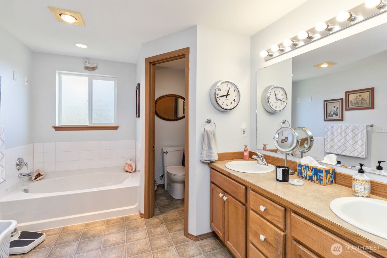 413 Haywire Road Winlock, WA 98596 - Photo 30 of 40 a spacious bathroom with a tub sink and mirror