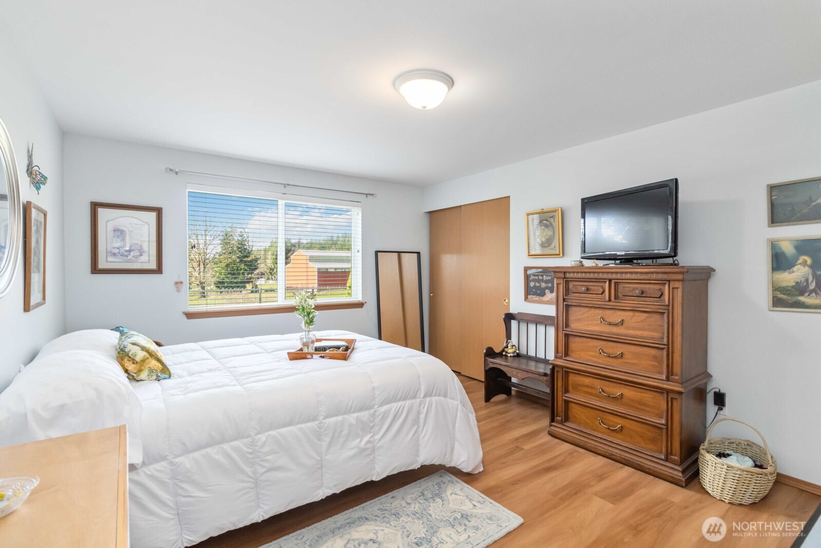 413 Haywire Road Winlock, WA 98596 - Photo 31 of 40 a bedroom with a bed and a flat screen tv