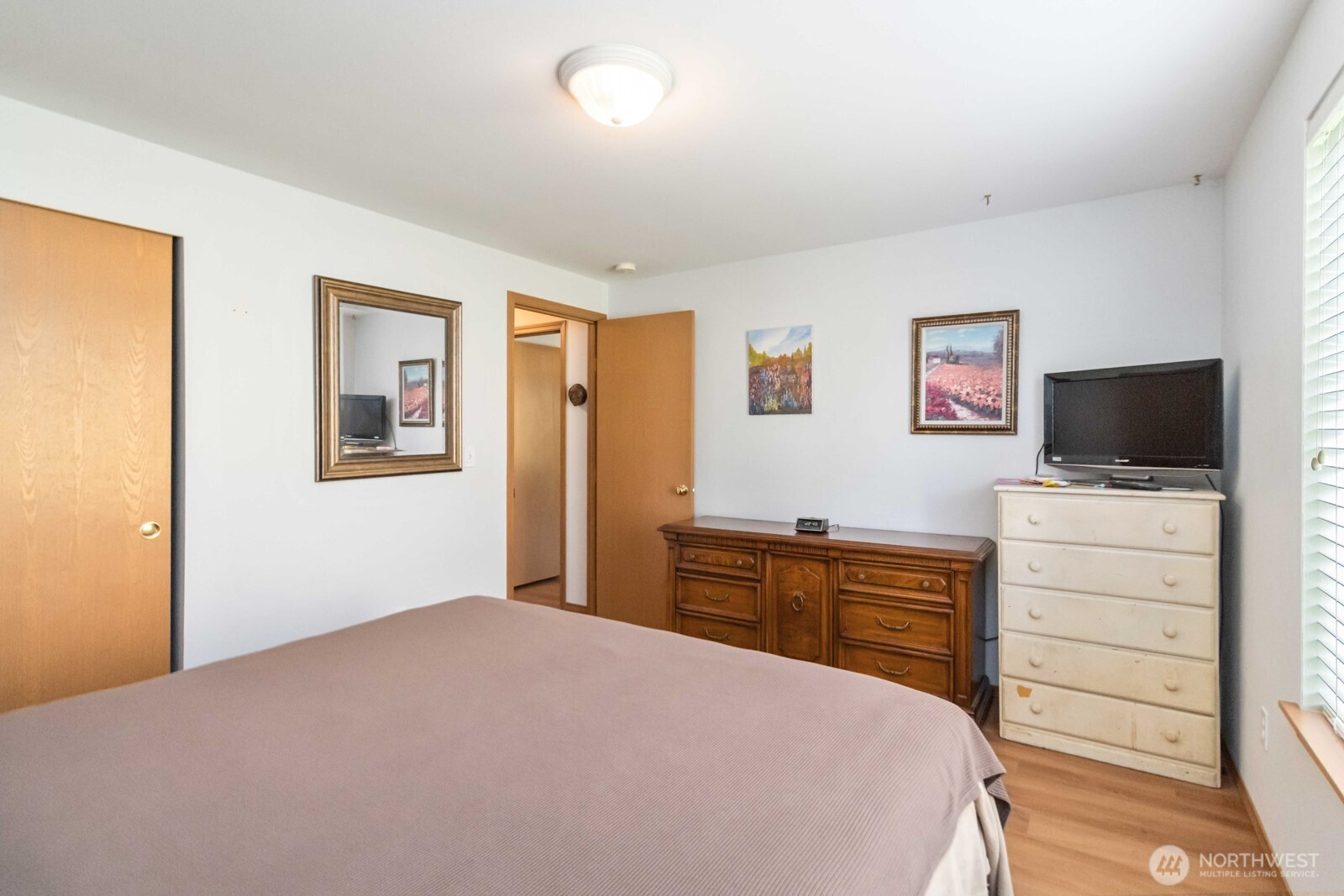 413 Haywire Road Winlock, WA 98596 - Photo 36 of 40 a bedroom with a bed and a flat screen tv