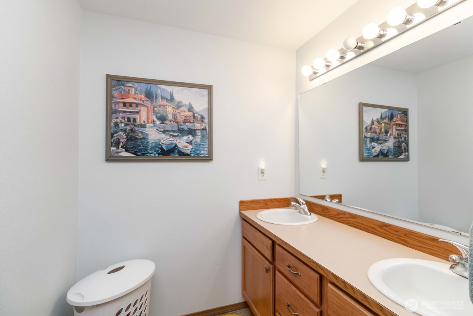 413 Haywire Road Winlock, WA 98596 - Photo 37 of 40 a bathroom with a granite countertop sink mirror vanity and toilet