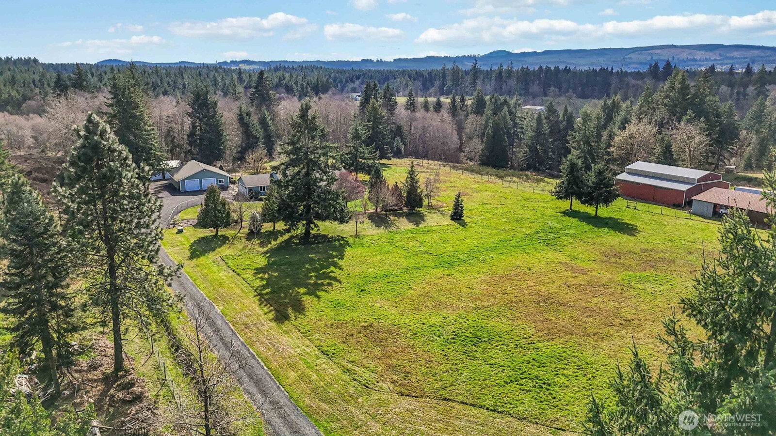 413 Haywire Road Winlock, WA 98596 - Photo 6 of 40 a view of a lake from a yard
