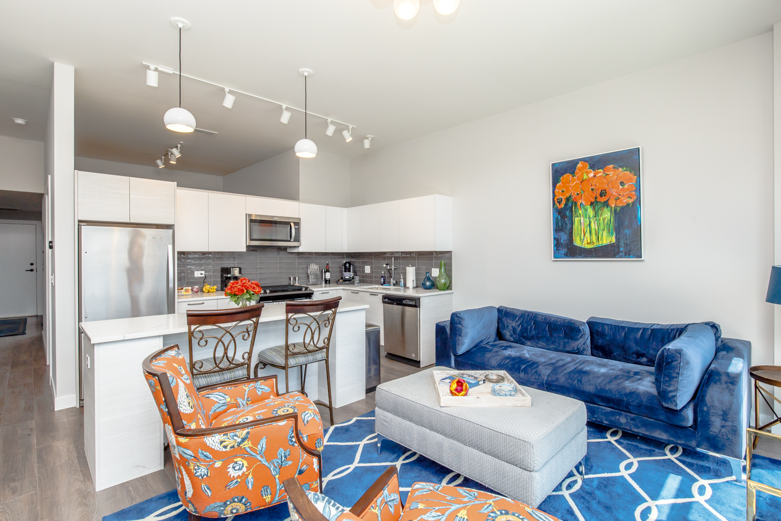 Undisclosed Address Chicago, IL 60610 - Photo 3 of 12 a living room with stainless steel appliances kitchen island a table and chairs