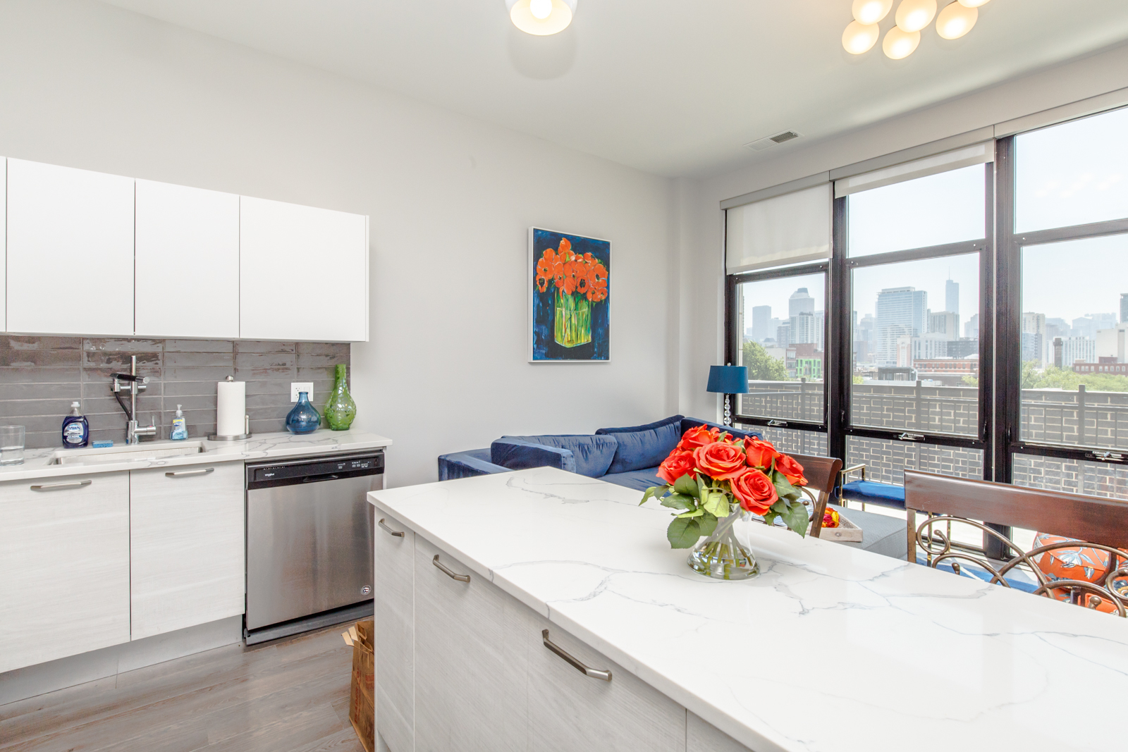 Undisclosed Address Chicago, IL 60610 - Photo 5 of 12 a kitchen with stainless steel appliances kitchen island wooden cabinets and a counter top space