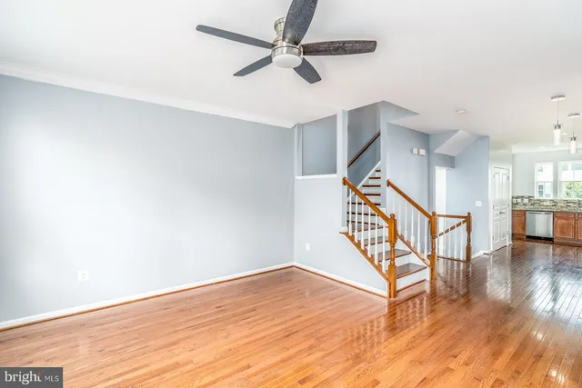 a view of an entryway with wooden floor