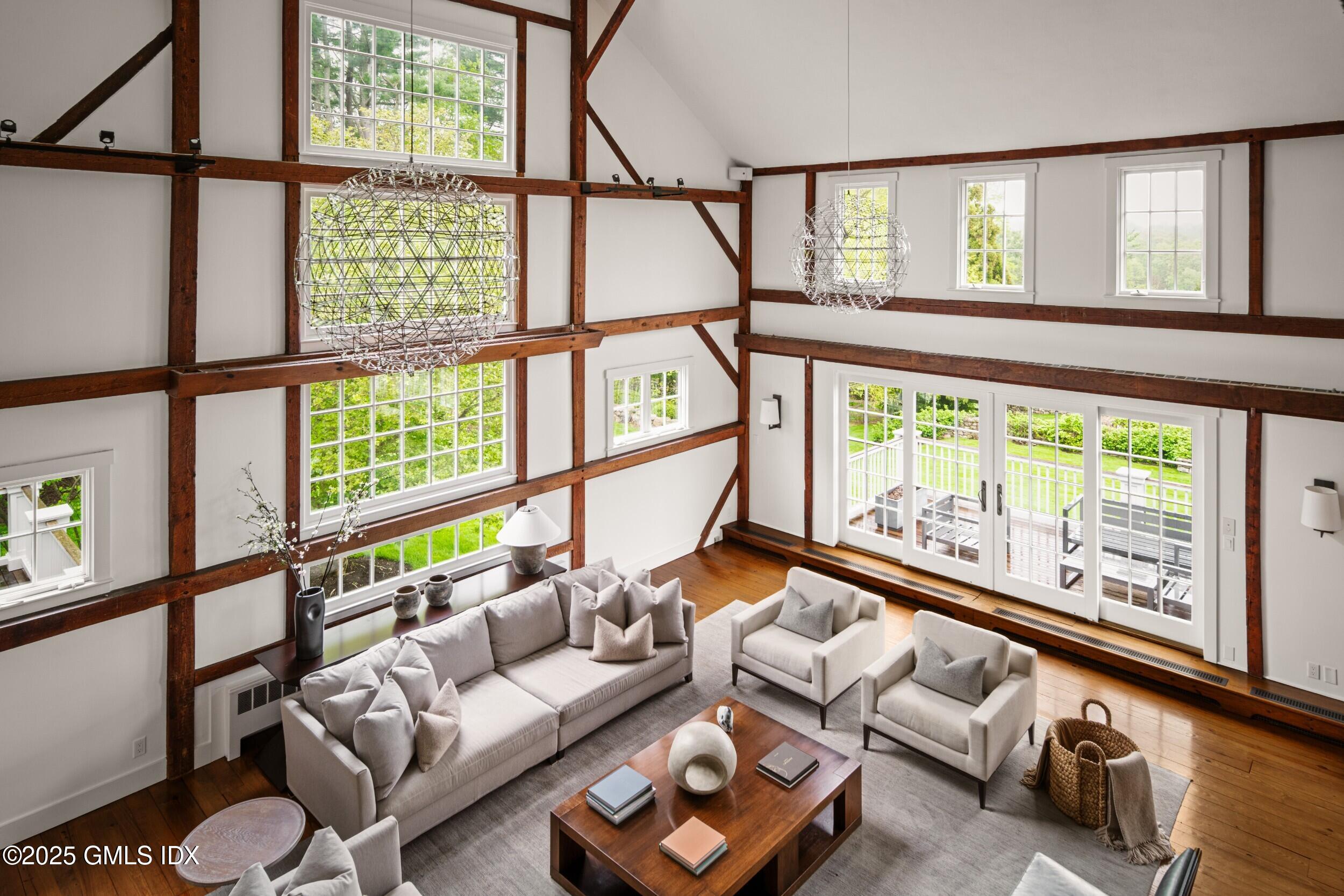 945 Oenoke Ridge New Canaan, CT 06840 - Photo 22 of 94 a living room with furniture and a large window