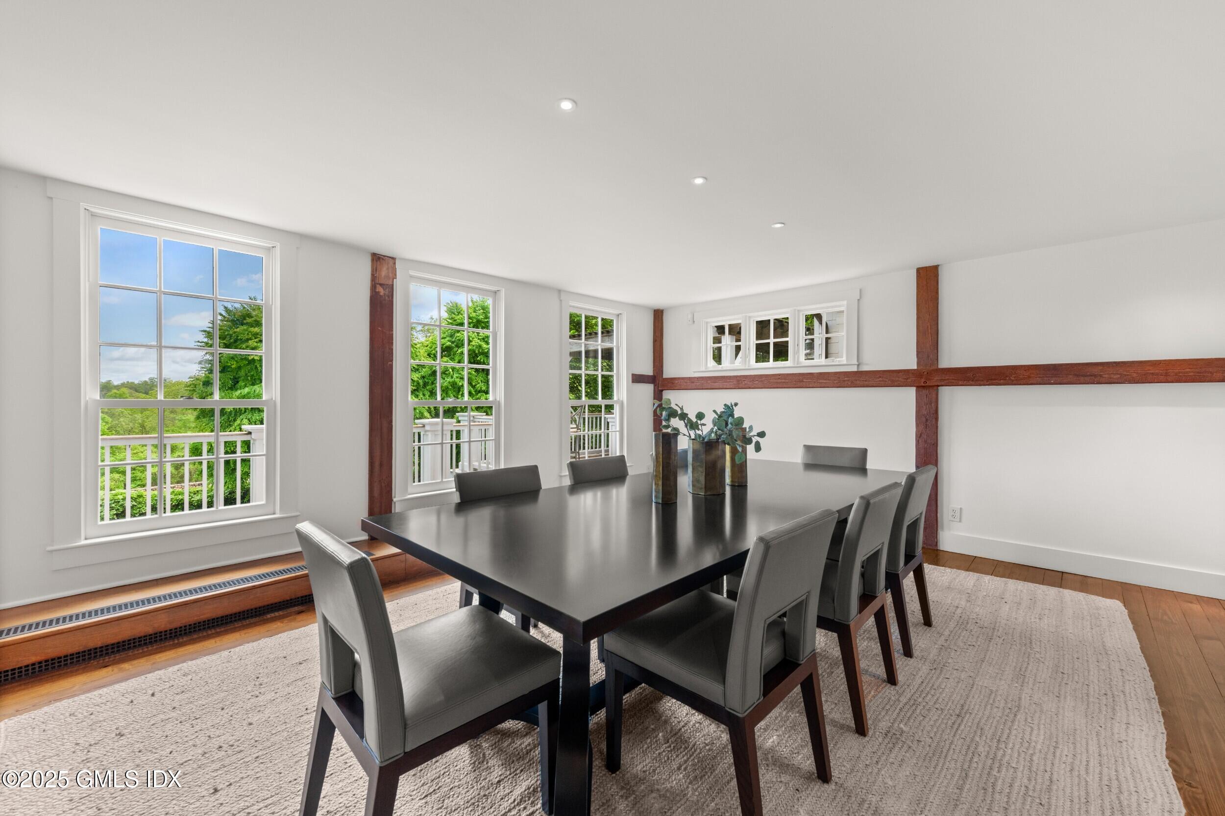 945 Oenoke Ridge New Canaan, CT 06840 - Photo 34 of 94 a view of a dining room with furniture and wooden floor