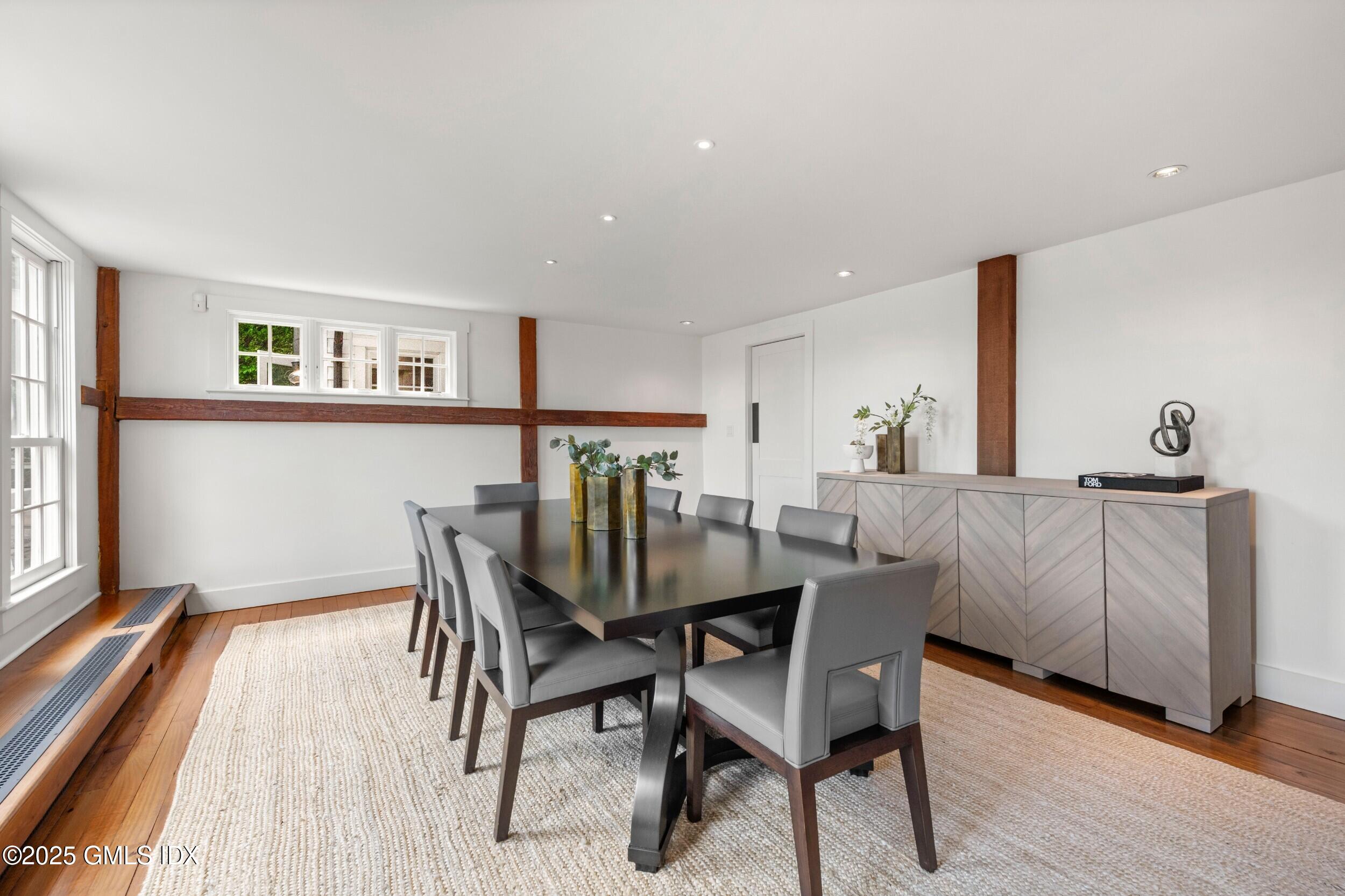 945 Oenoke Ridge New Canaan, CT 06840 - Photo 35 of 94 a dining room with furniture and wooden floor