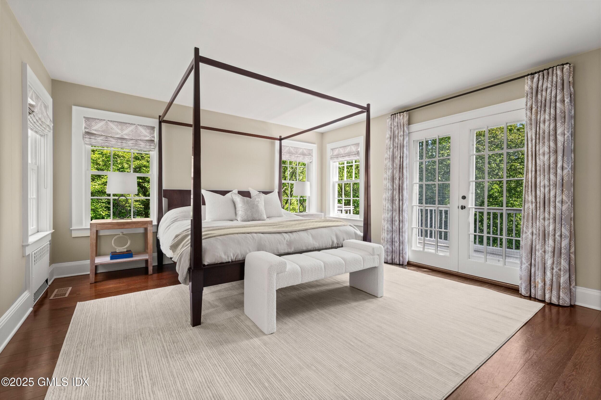 945 Oenoke Ridge New Canaan, CT 06840 - Photo 40 of 94 a bedroom with furniture and a large window